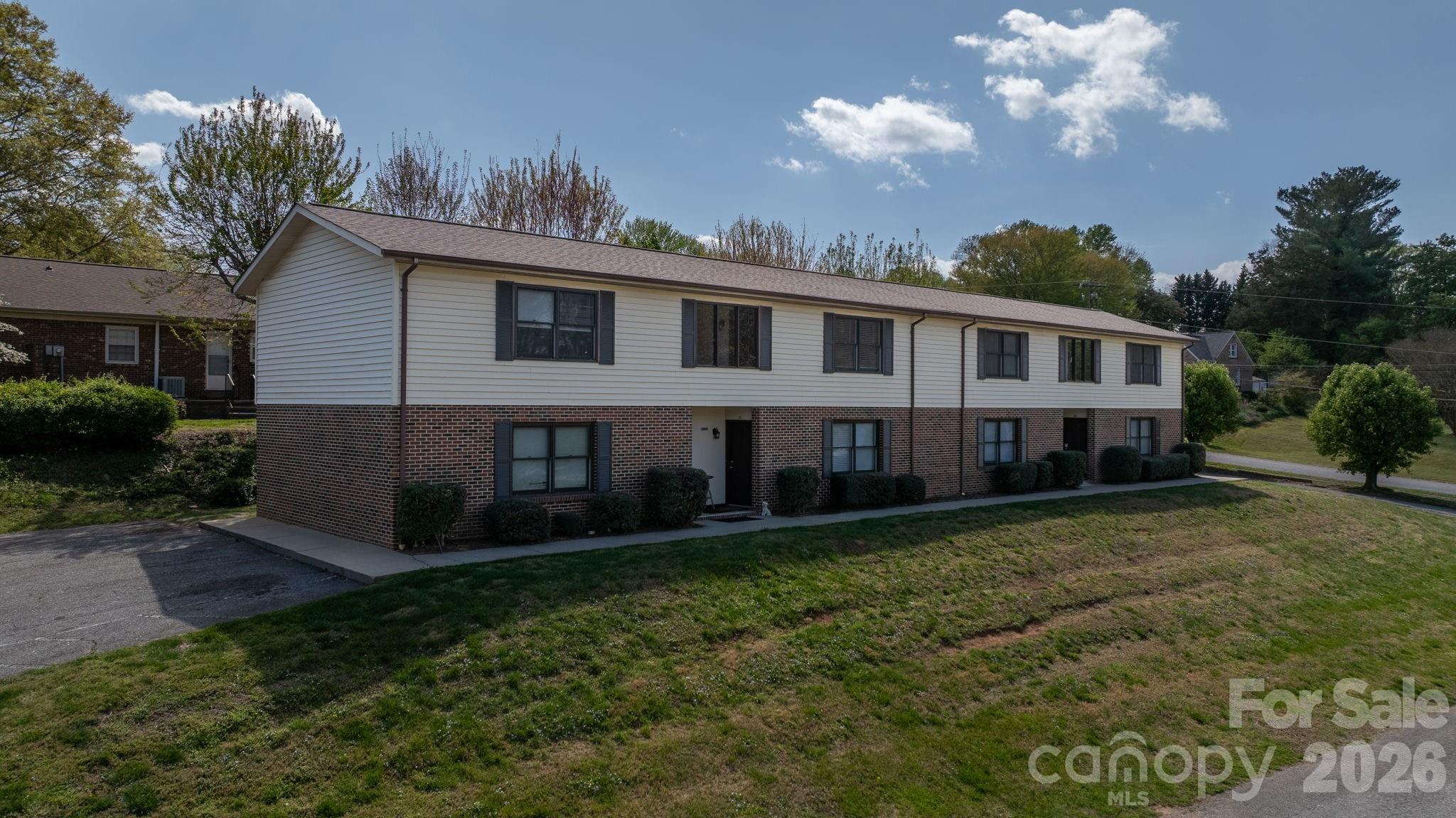 525 12th Street Southwest, Unit 30 Hickory, NC 28602 - Photo 18 of 22 a view of a house with a yard