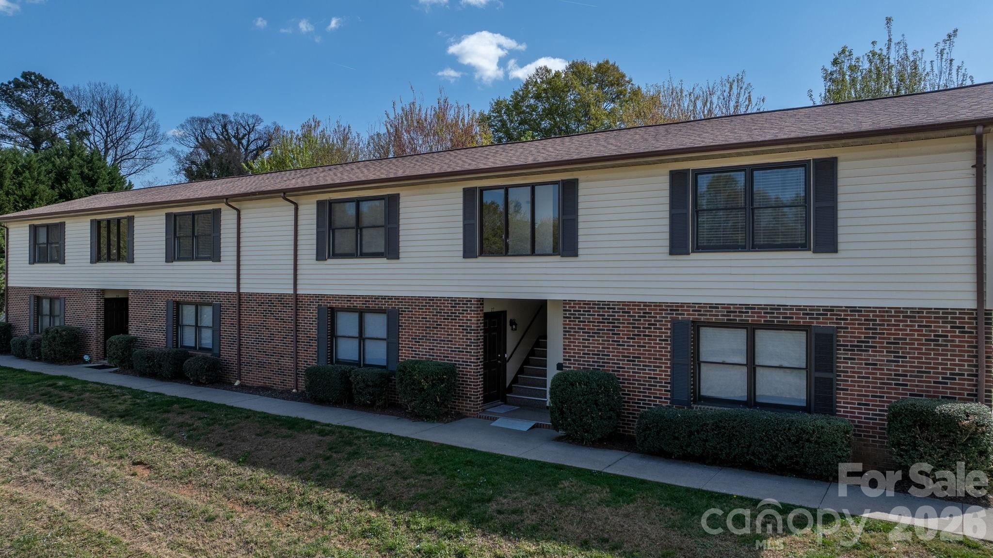525 12th Street Southwest, Unit 30 Hickory, NC 28602 - Photo 2 of 22 a view of a house with a yard