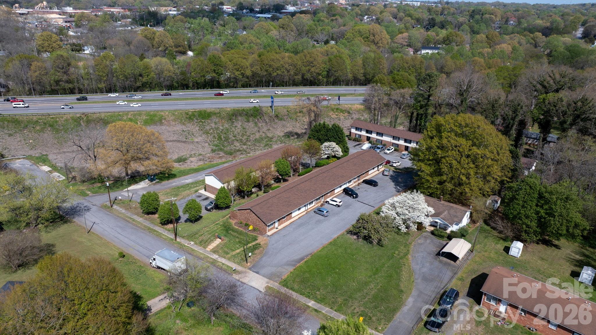525 12th Street Southwest, Unit 30 Hickory, NC 28602 - Photo 22 of 22 an aerial view of a house with a garden and lake view