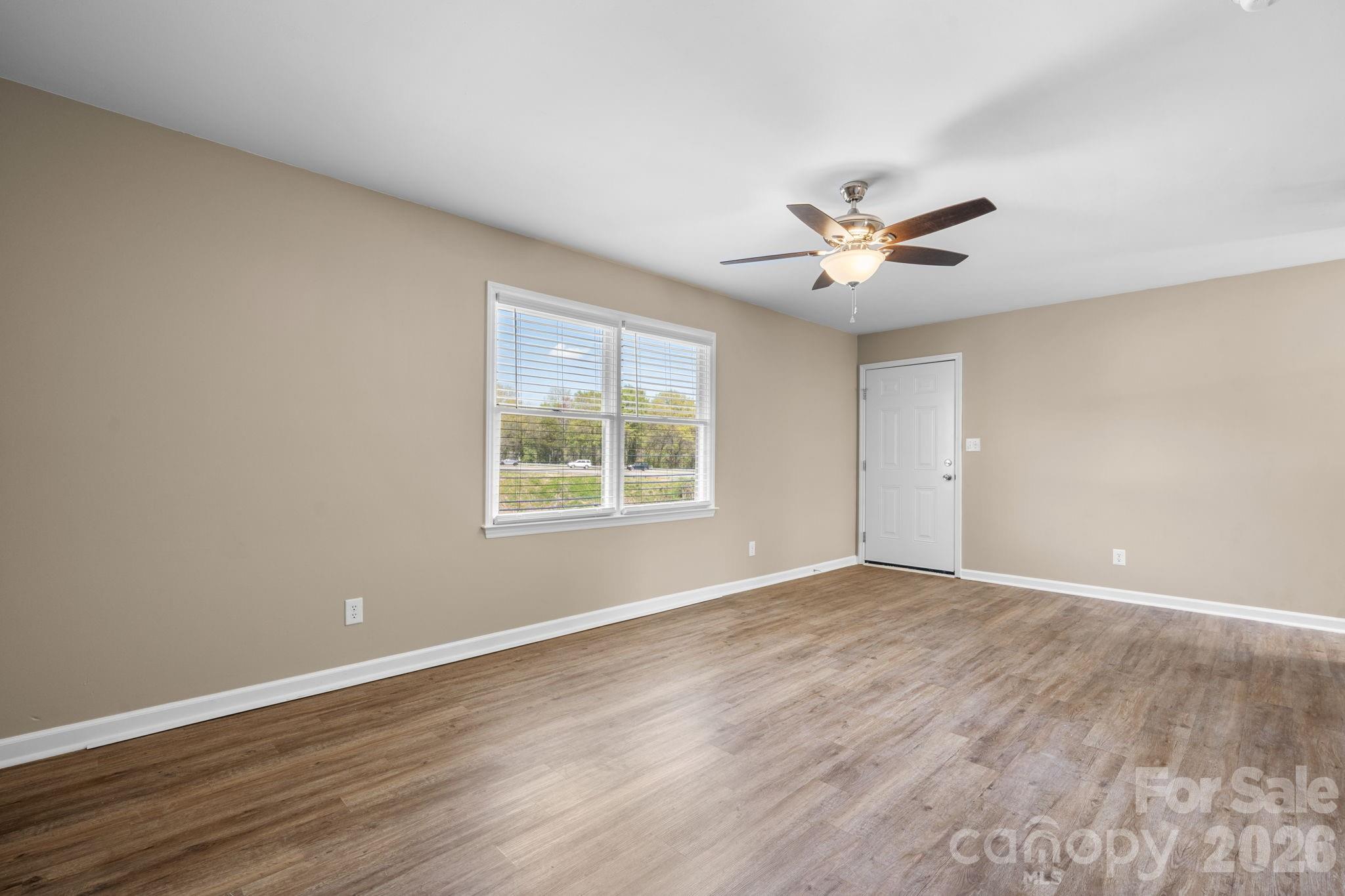 525 12th Street Southwest, Unit 30 Hickory, NC 28602 - Photo 3 of 22 wooden floor in an empty room with a window