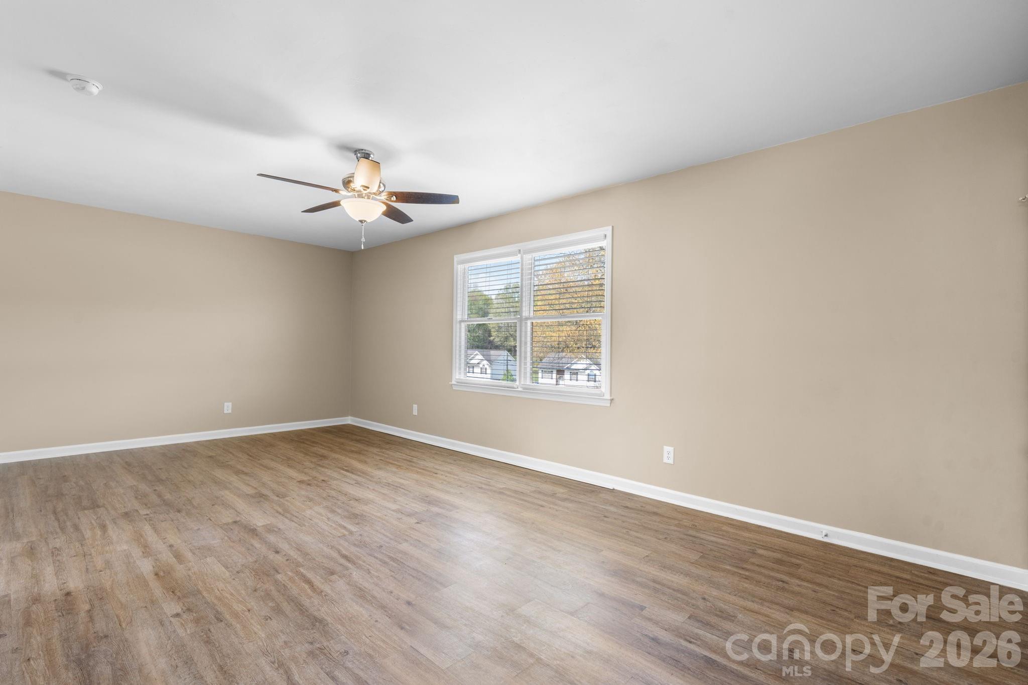 525 12th Street Southwest, Unit 30 Hickory, NC 28602 - Photo 4 of 22 wooden floor in an empty room with a window