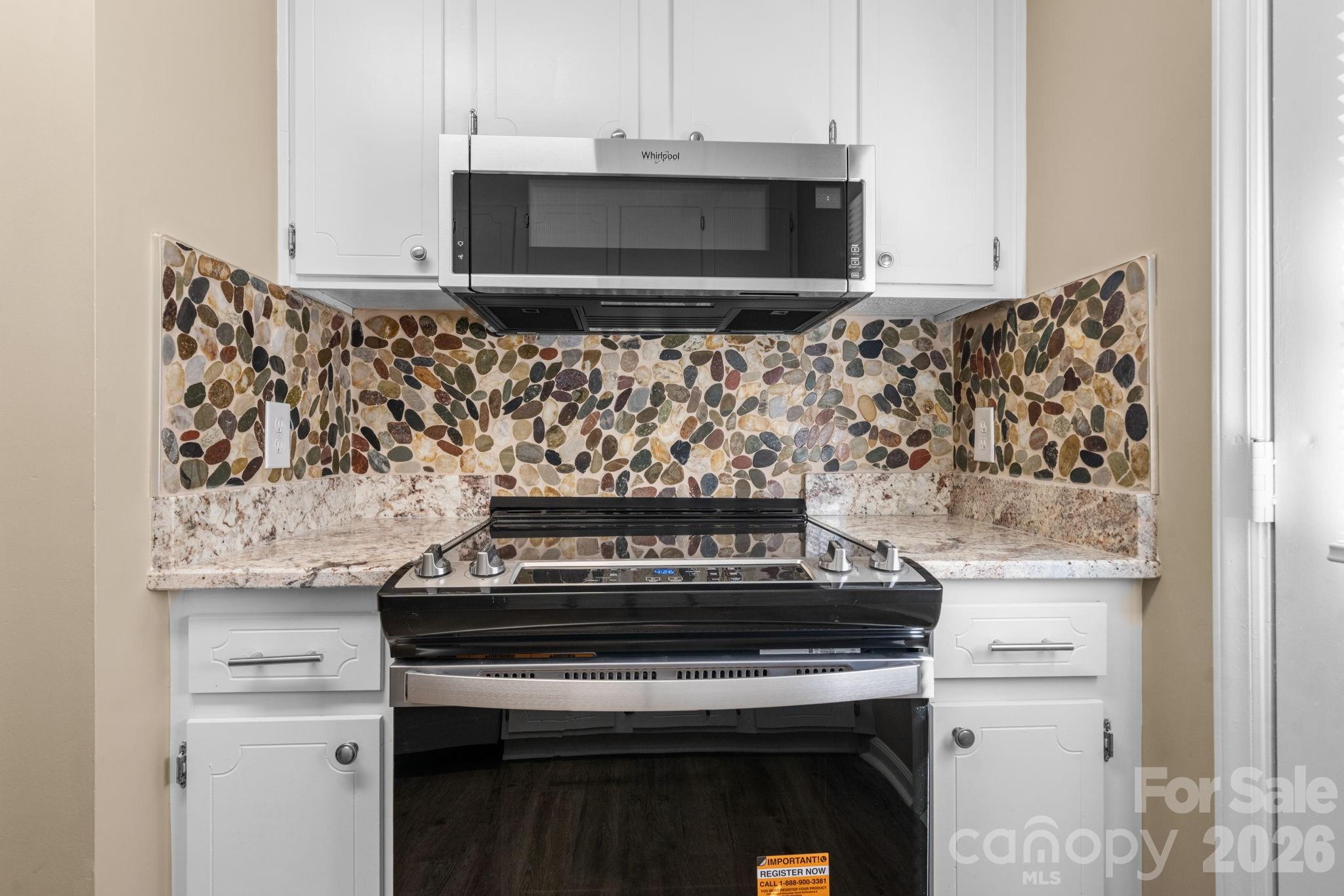 525 12th Street Southwest, Unit 30 Hickory, NC 28602 - Photo 9 of 22 a stove top oven sitting inside of a kitchen