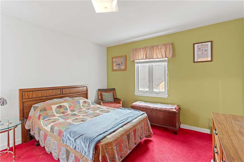 720 6th Street Verona, PA 15147 - Photo 12 of 28 a bedroom with a bed and wooden floor