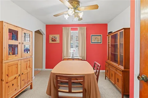 a view of a livingroom with furniture window and wooden floor