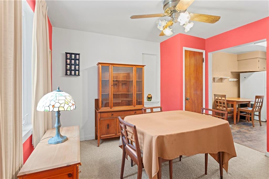 720 6th Street Verona, PA 15147 - Photo 17 of 28 a dining room with chandelier and wooden floor