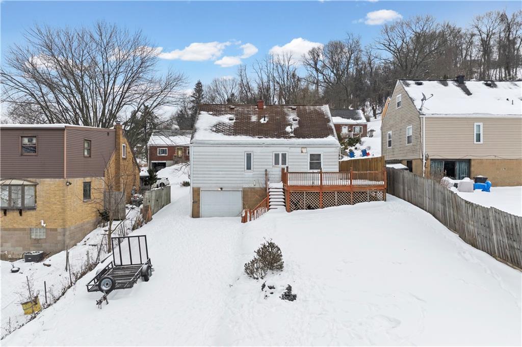 720 6th Street Verona, PA 15147 - Photo 2 of 28 a view of a house with a yard covered in snow