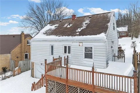 a view of a house with a small yard
