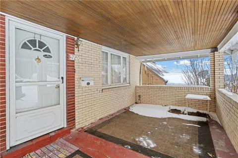 a view of a door and a window