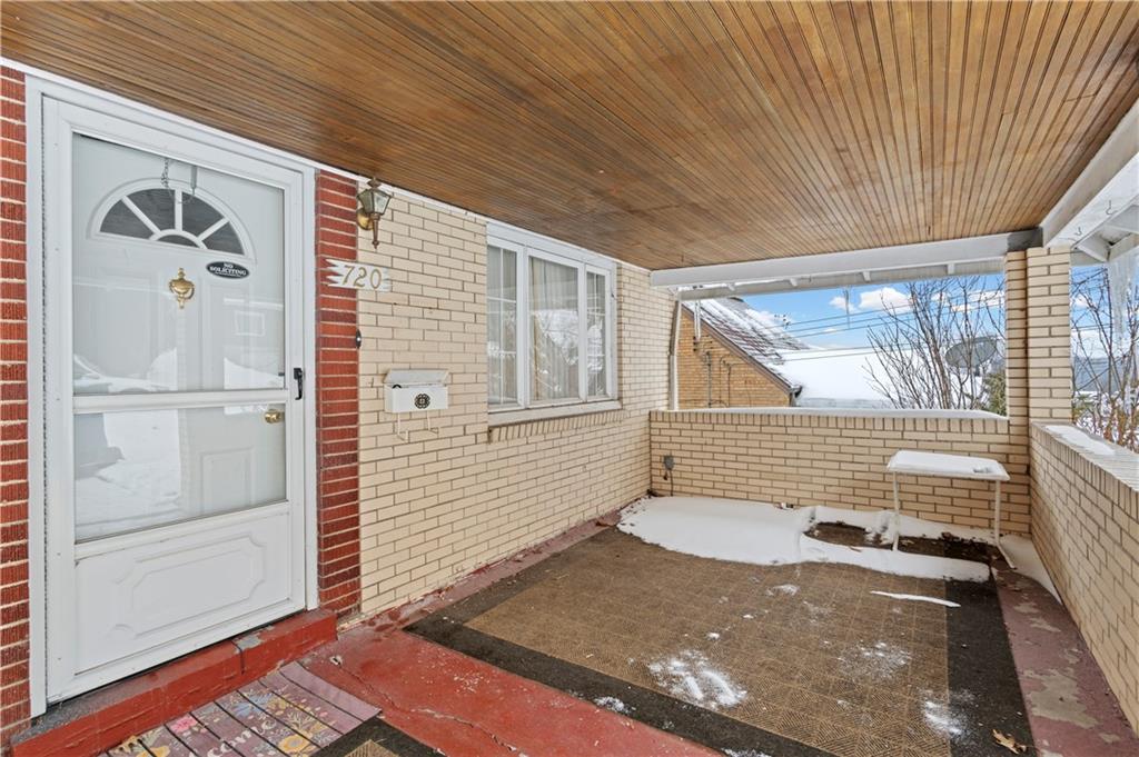 720 6th Street Verona, PA 15147 - Photo 4 of 28 a view of a door and a window