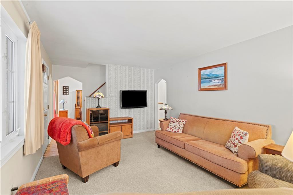 720 6th Street Verona, PA 15147 - Photo 8 of 28 a living room with furniture and a flat screen tv