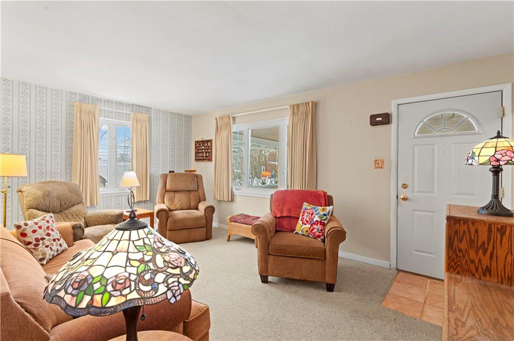 720 6th Street Verona, PA 15147 - Photo 9 of 28 a living room with furniture and a large window
