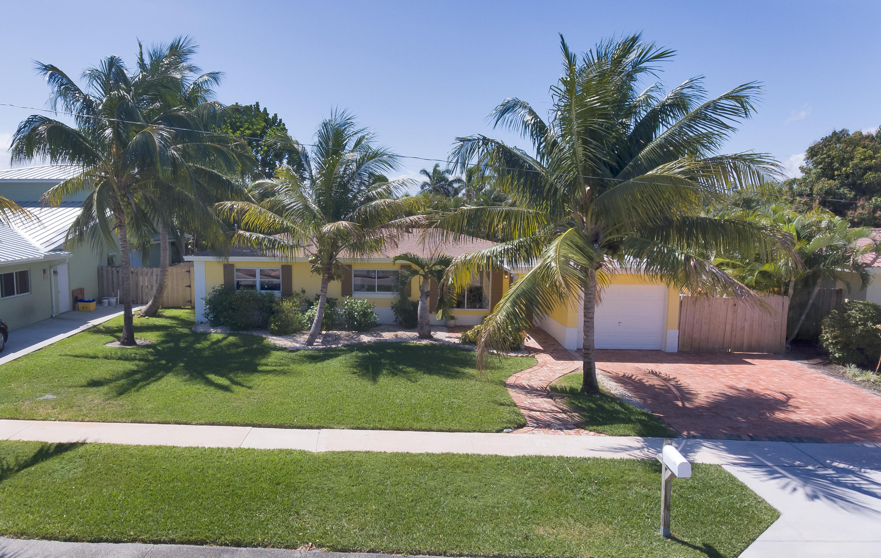 334 Northeast 28th Road Boca Raton, FL 33431 - Photo 25 of 32 a view of a house with a yard