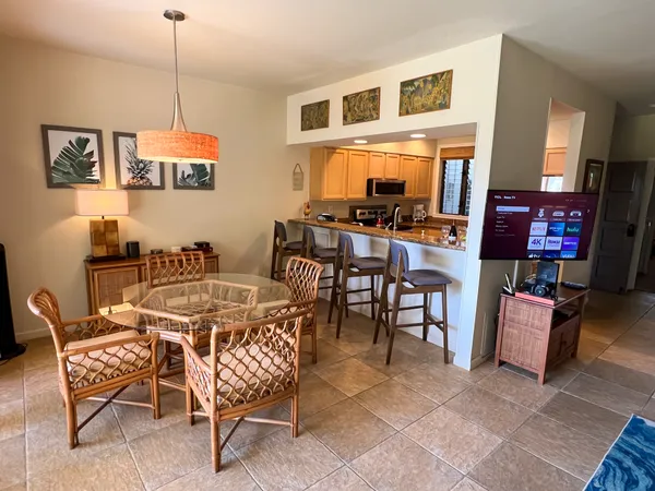 a dining room with furniture and window