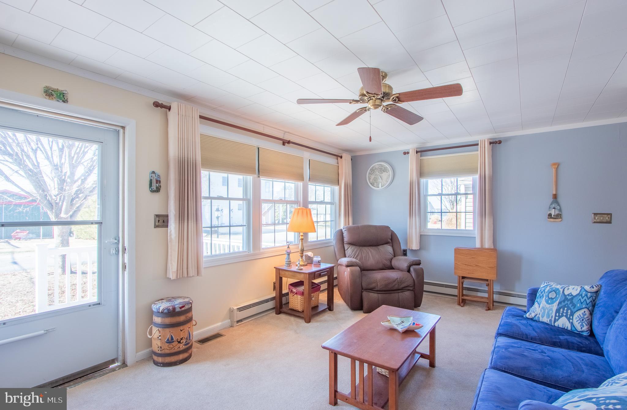 40 High Road Earleville, MD 21919 - Photo 11 of 42 a living room with furniture a flat screen tv and a window