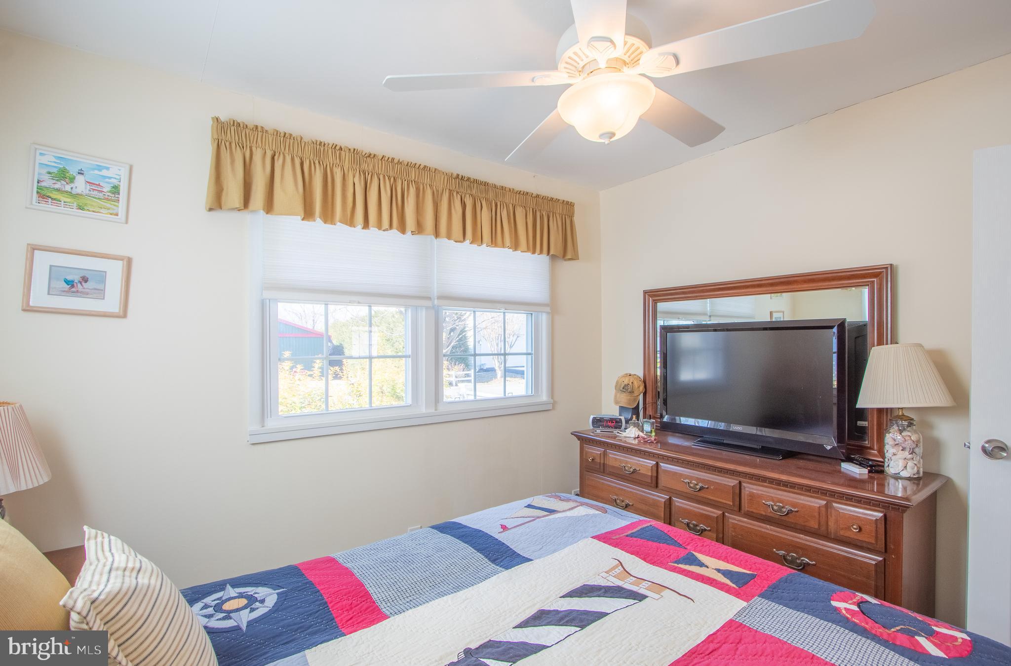 40 High Road Earleville, MD 21919 - Photo 20 of 42 a living room with furniture and a flat screen tv