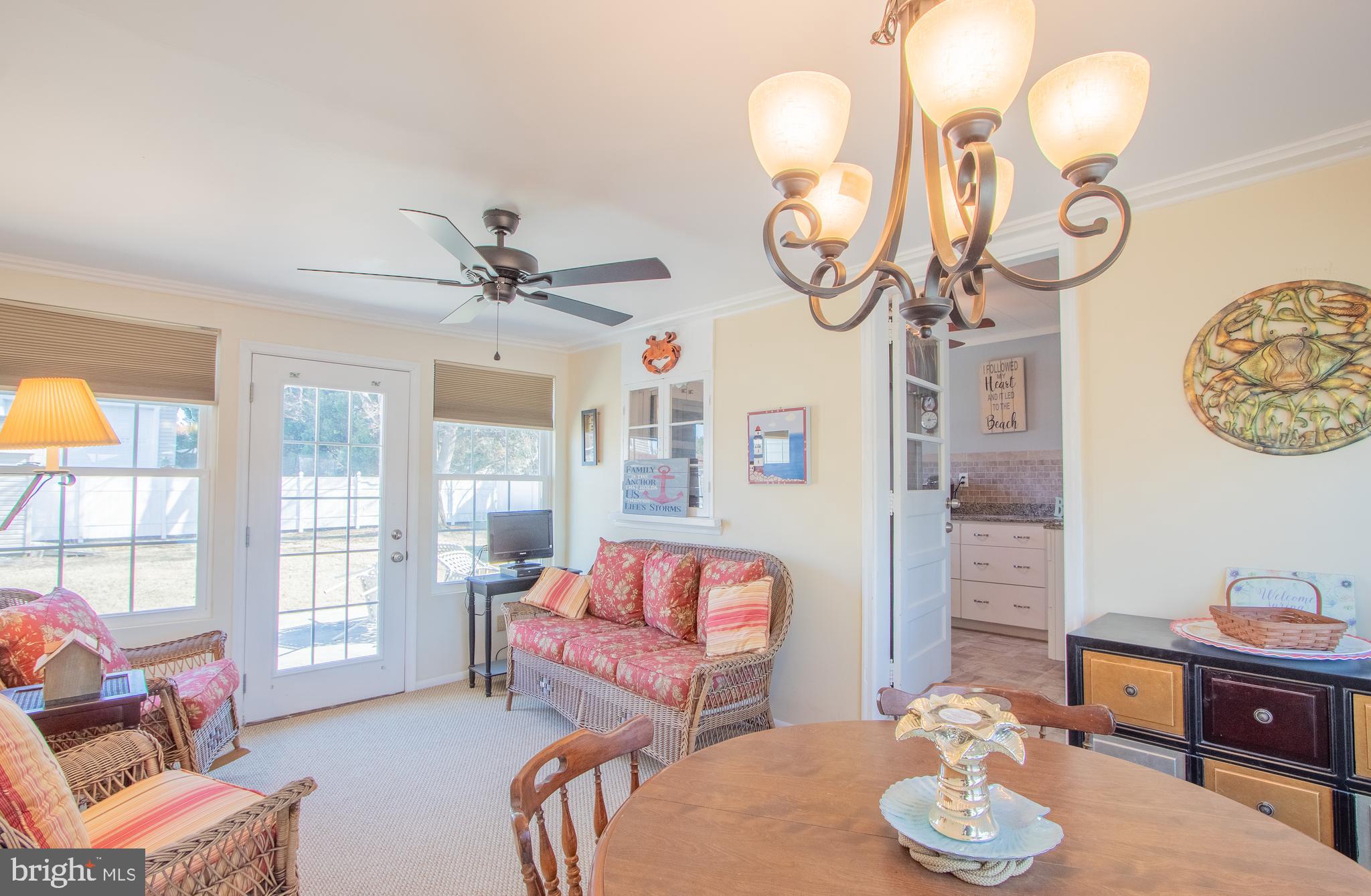 40 High Road Earleville, MD 21919 - Photo 21 of 42 a living room with furniture chandelier and a large window