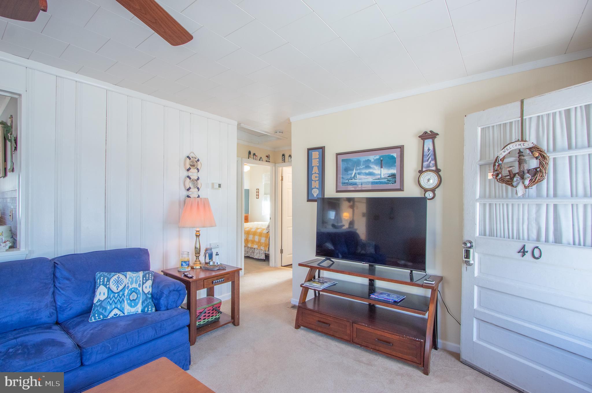40 High Road Earleville, MD 21919 - Photo 5 of 42 a living room with furniture and a flat screen tv