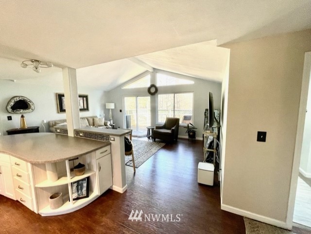 17818 Southeast 136th Street Renton, WA 98059 - Photo 5 of 23 a open kitchen with stainless steel appliances granite countertop a lot of counter space and wooden floor