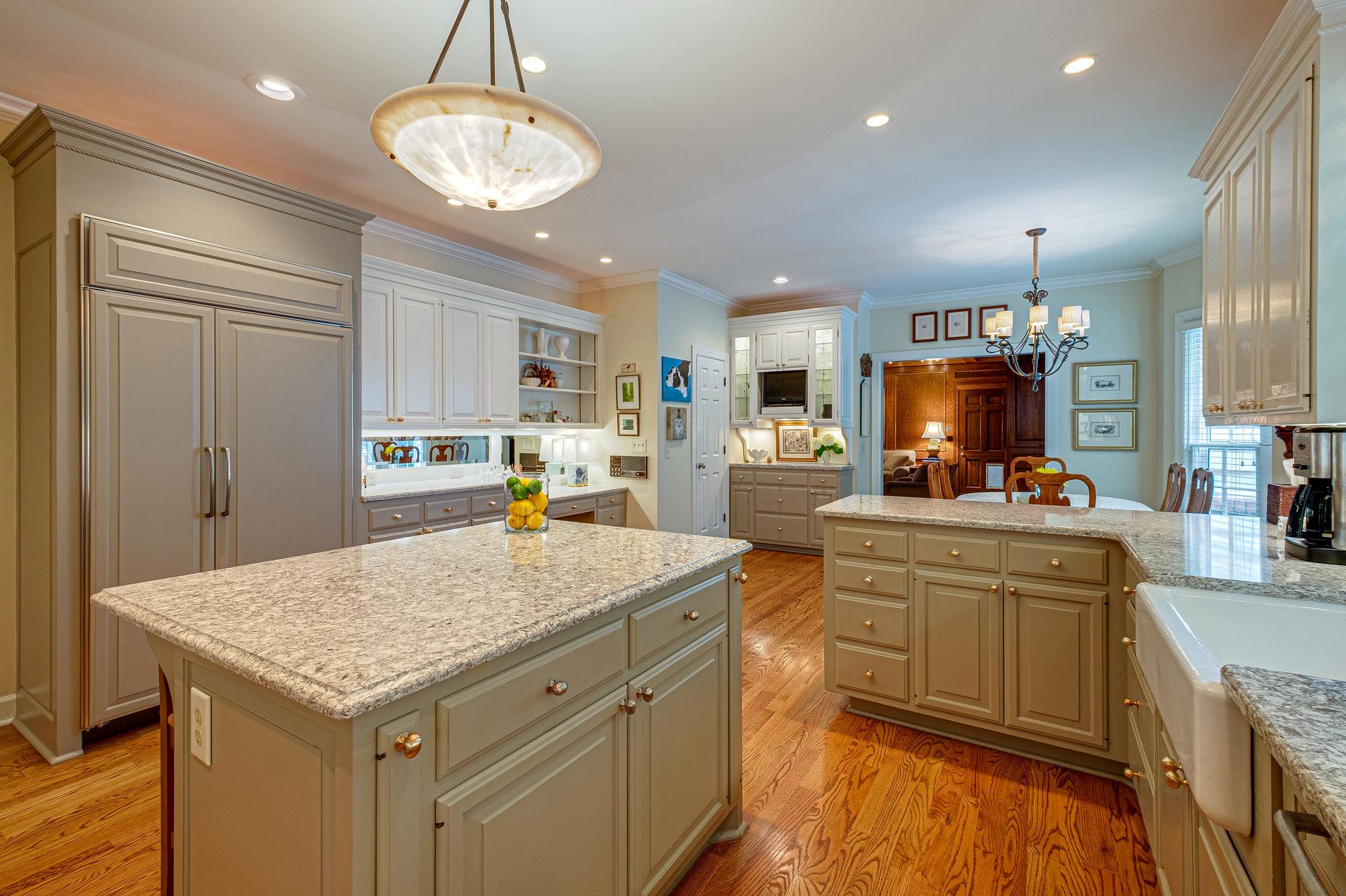 1005 Scramblers Knob Franklin, TN 37069 - Photo 12 of 29 a kitchen with kitchen island granite countertop a stove and a sink