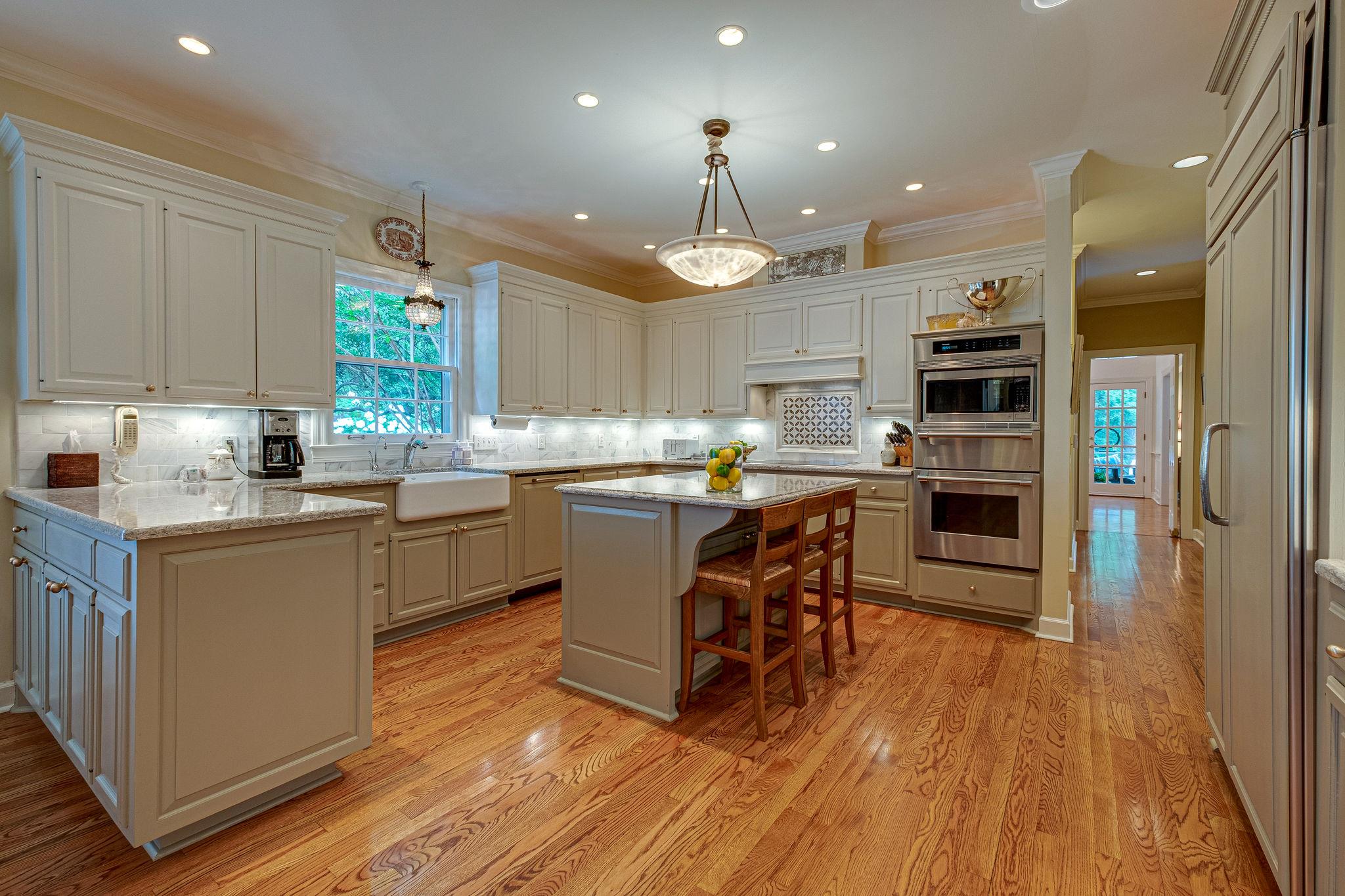 1005 Scramblers Knob Franklin, TN 37069 - Photo 13 of 29 a kitchen with kitchen island granite countertop a sink cabinets and stainless steel appliances