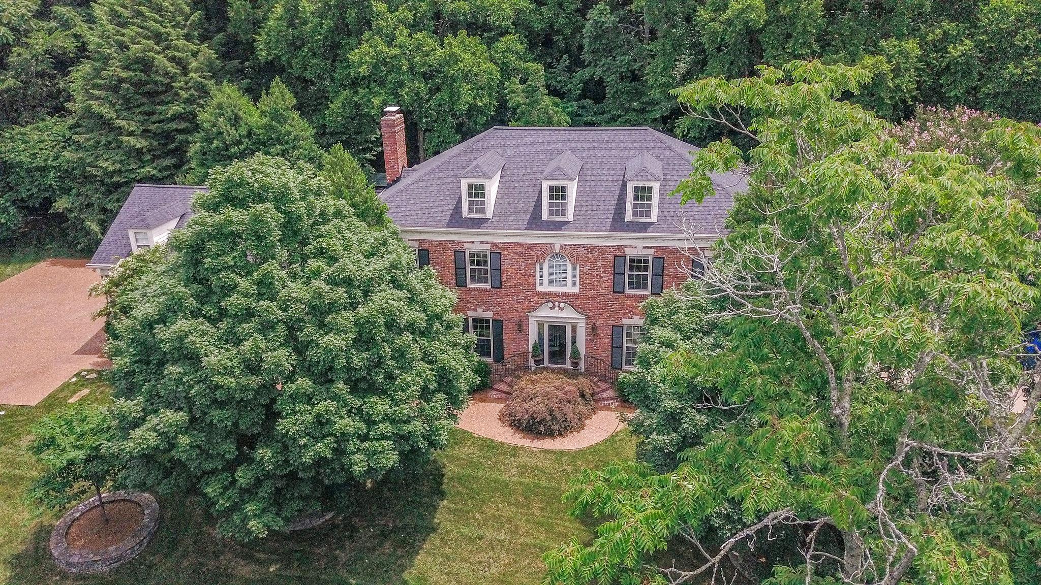 1005 Scramblers Knob Franklin, TN 37069 - Photo 2 of 29 a aerial view of a house with table and garden view