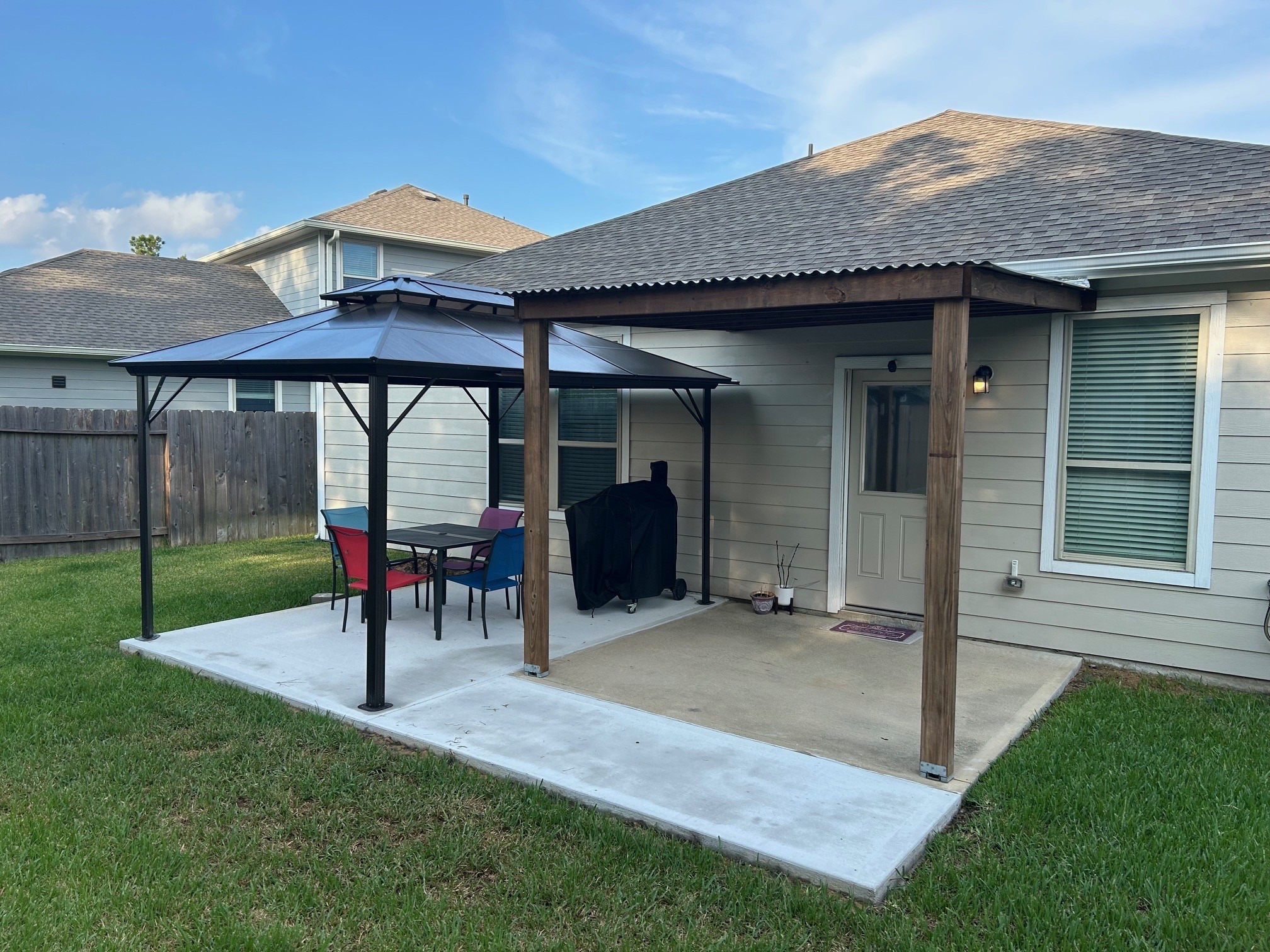 14449 Sunny Bend Way Conroe, TX 77303 - Photo 4 of 25 a view of a porch with a table and chairs under an umbrella