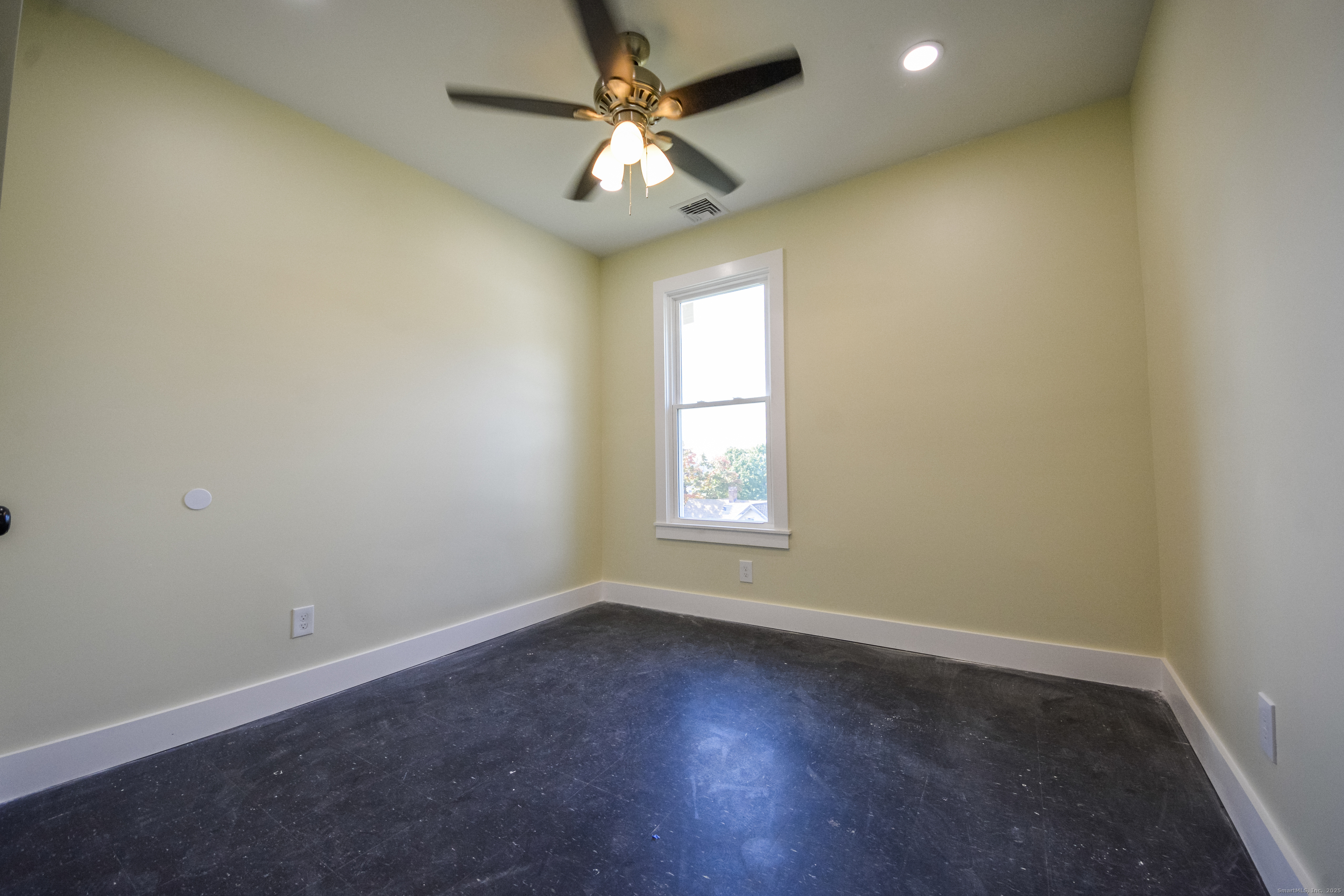 92 High Street, Unit 4W Waterbury, CT 06704 - Photo 12 of 22 an empty room with a window and a fan