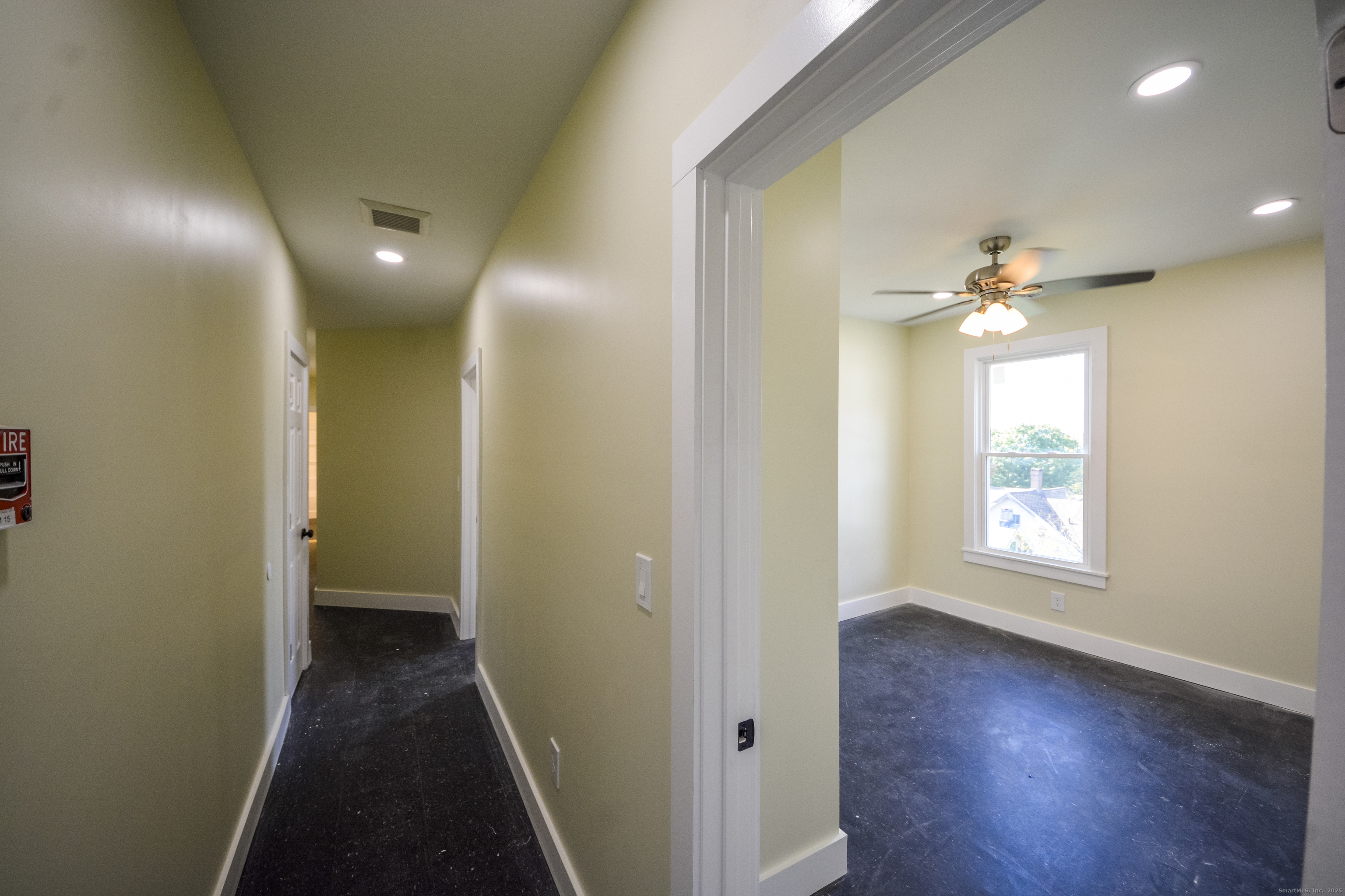 92 High Street, Unit 4W Waterbury, CT 06704 - Photo 16 of 22 a view of a hallway with wooden floor and a window