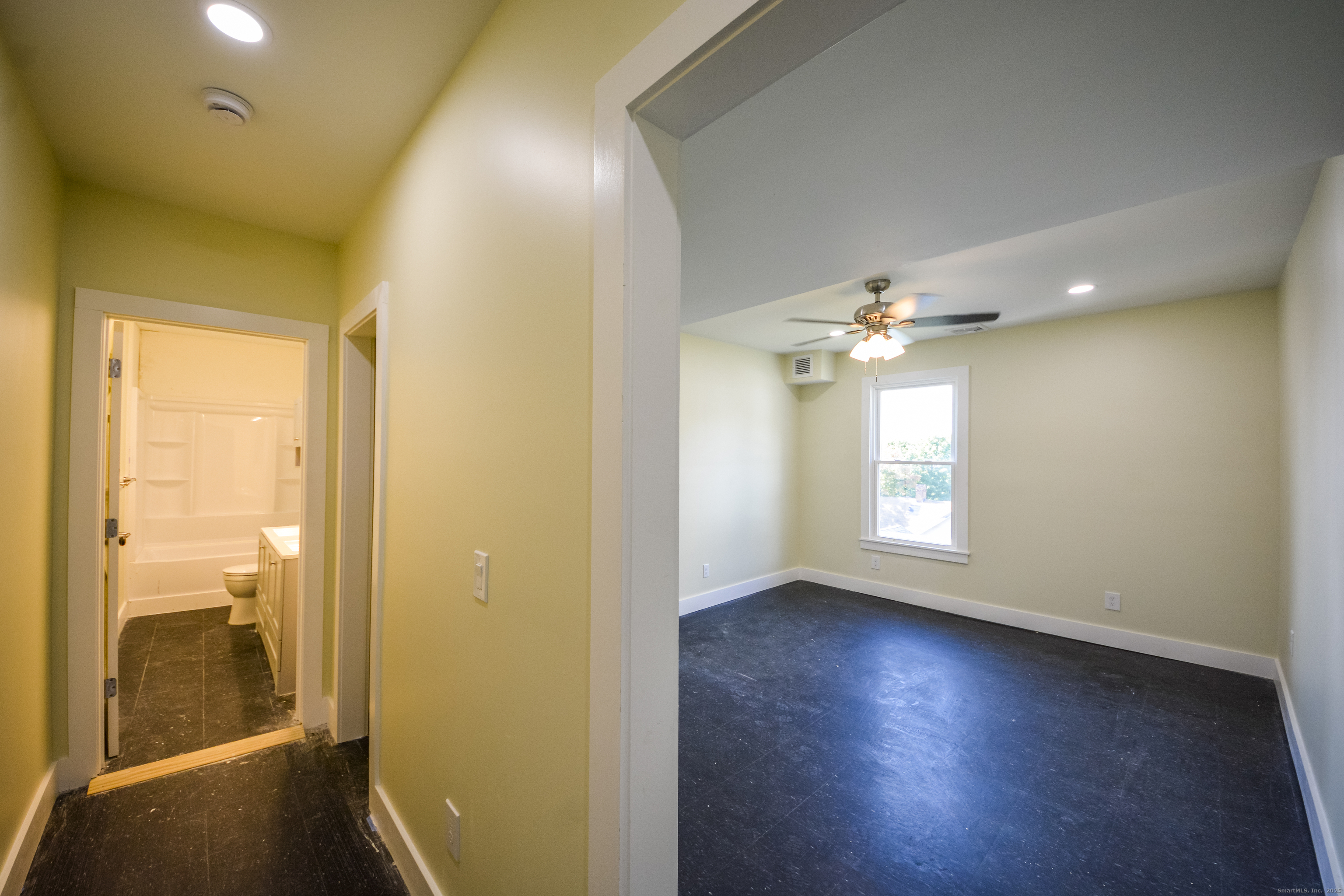 92 High Street, Unit 4W Waterbury, CT 06704 - Photo 18 of 22 an empty room with windows and closet