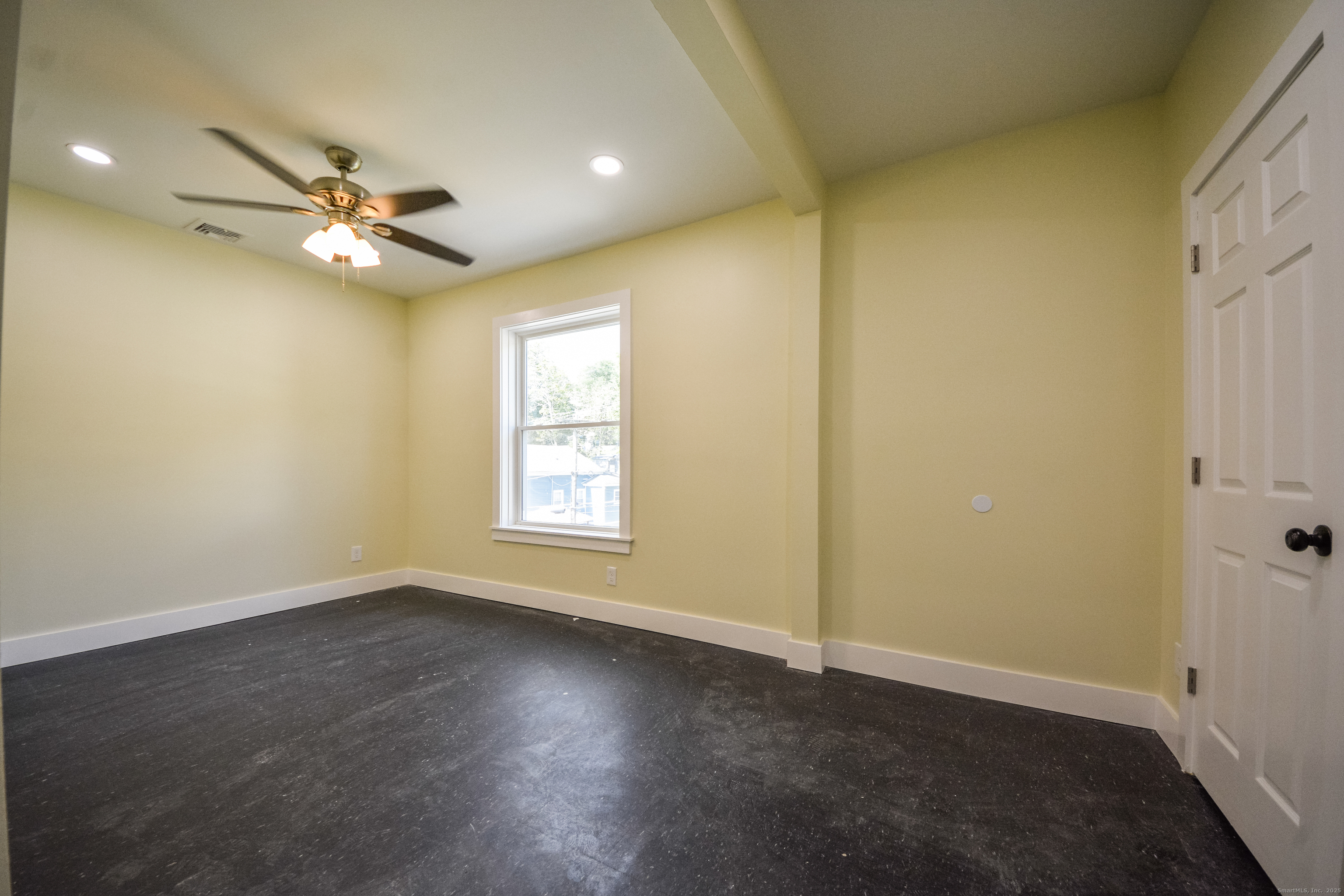 92 High Street, Unit 4W Waterbury, CT 06704 - Photo 22 of 22 an empty room and a ceiling fan and window
