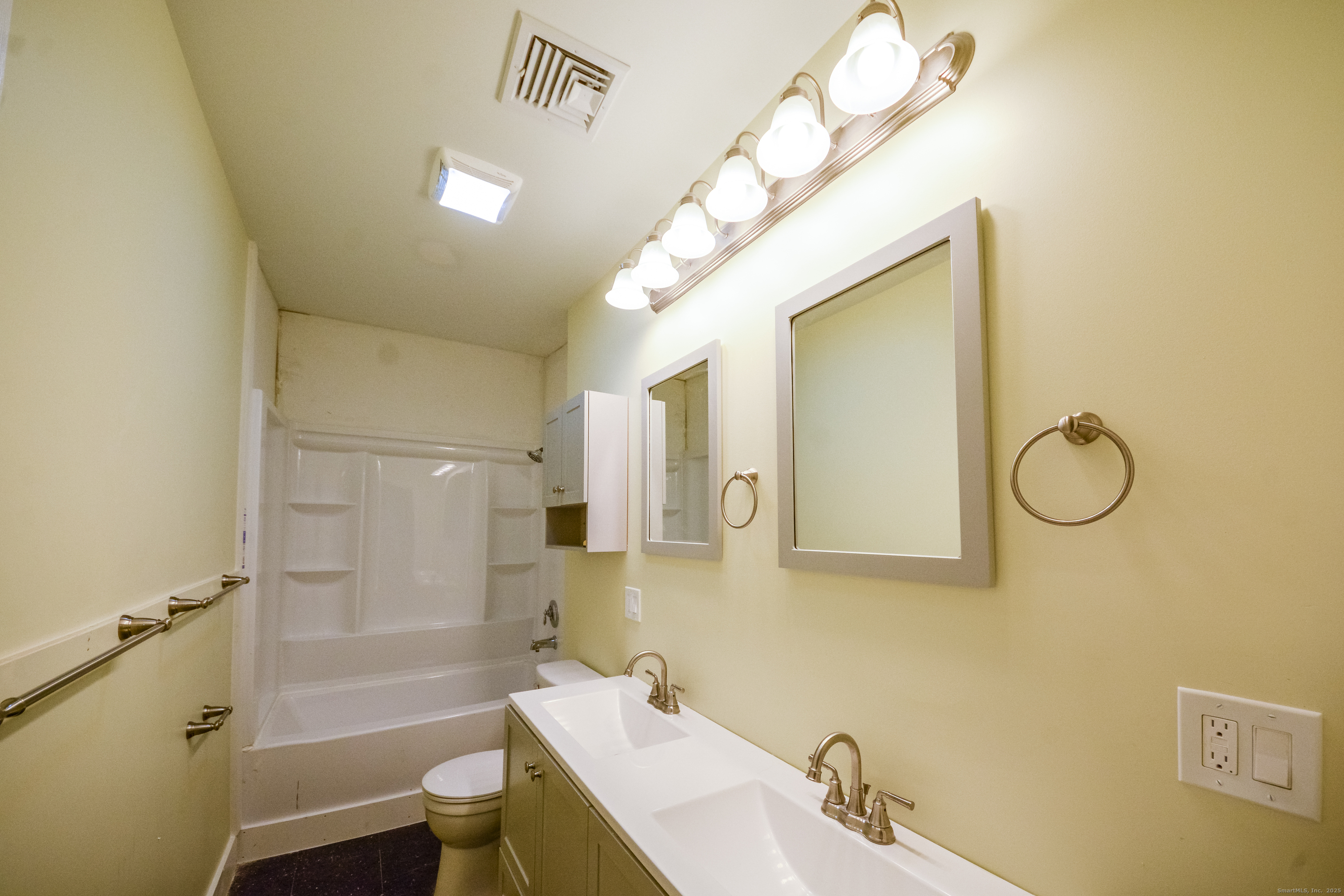 92 High Street, Unit 4W Waterbury, CT 06704 - Photo 4 of 22 a bathroom with a sink a toilet and shower