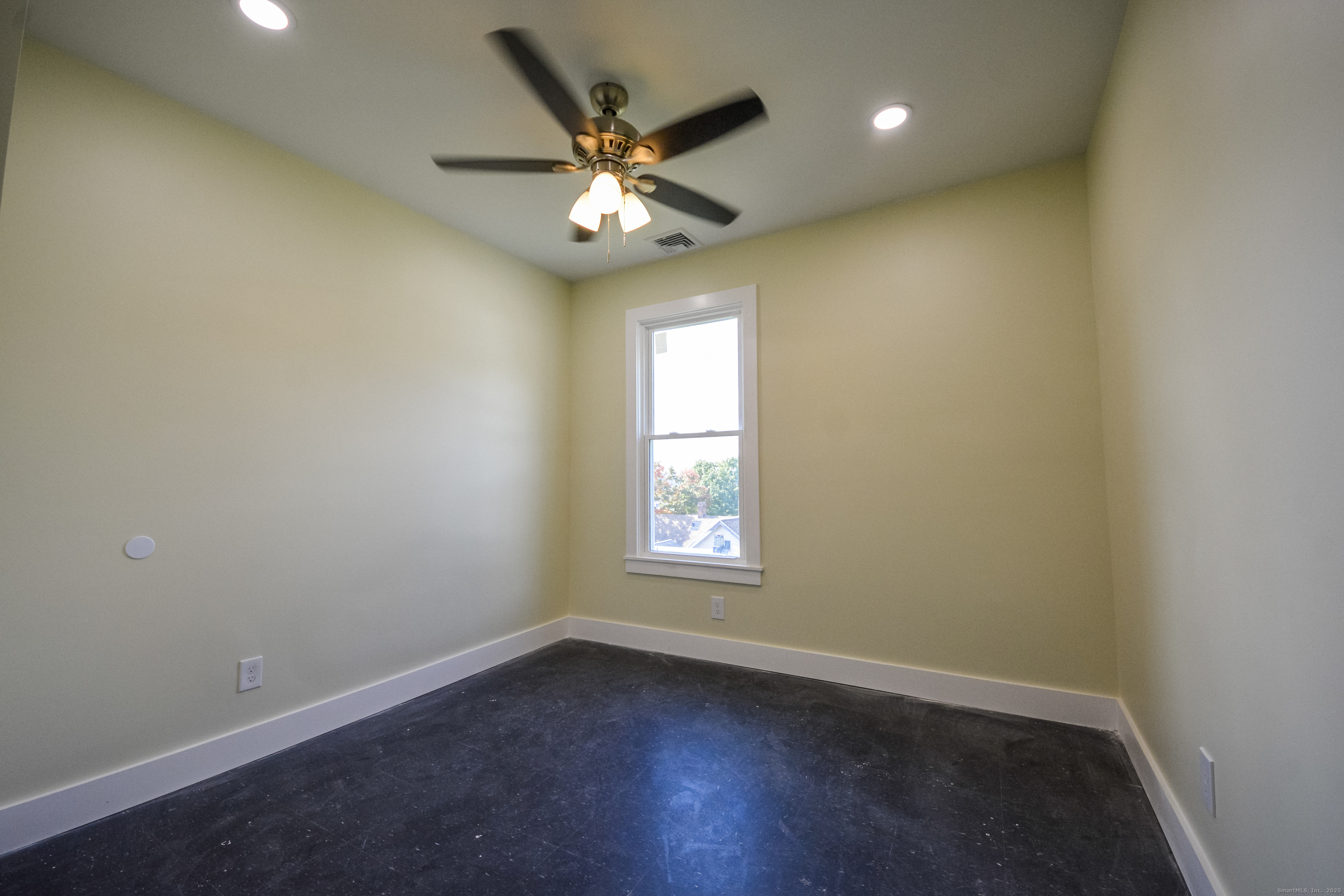 92 High Street, Unit 4W Waterbury, CT 06704 - Photo 9 of 22 an empty room with wooden floor and windows