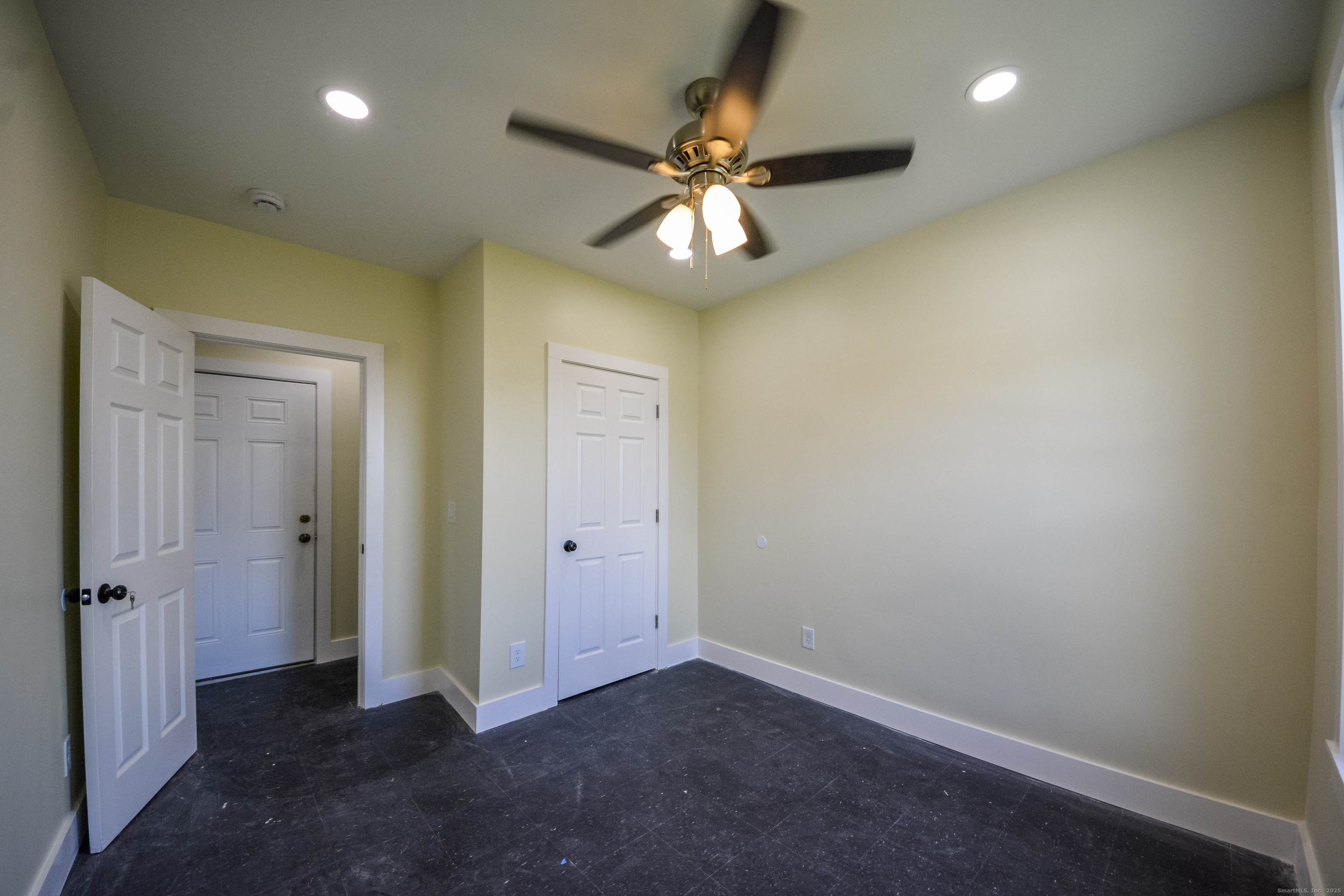 92 High Street, Unit 4W Waterbury, CT 06704 - Photo 10 of 22 an empty room and chandelier fan