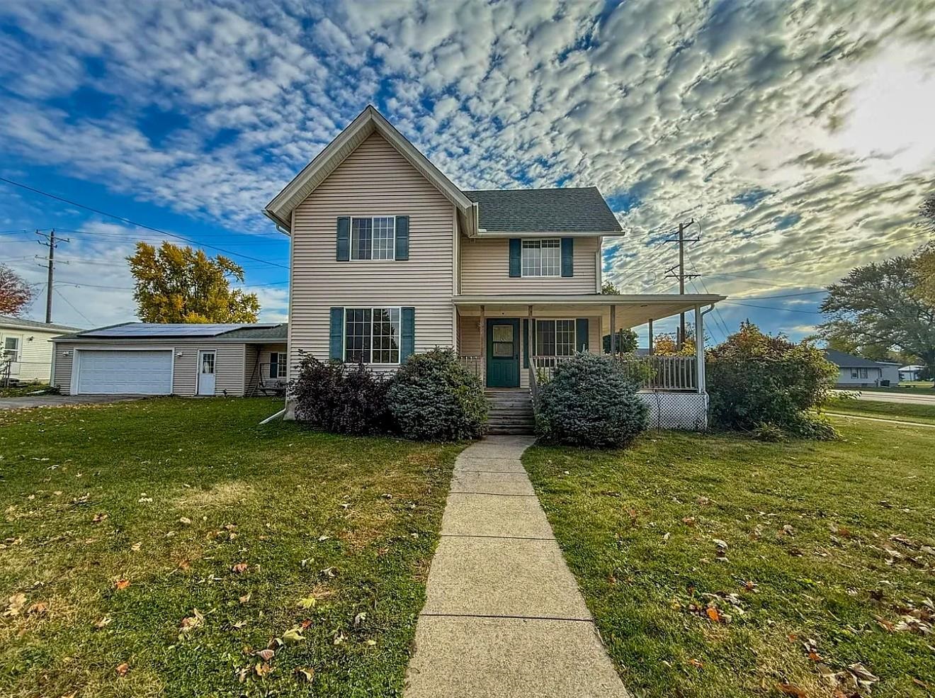 a front view of a house with garden