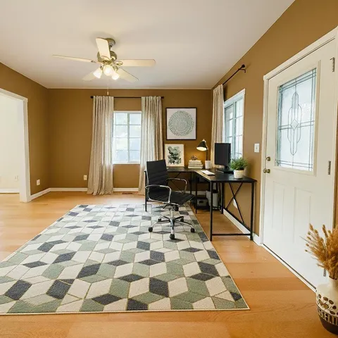 a view of an empty room with glass door