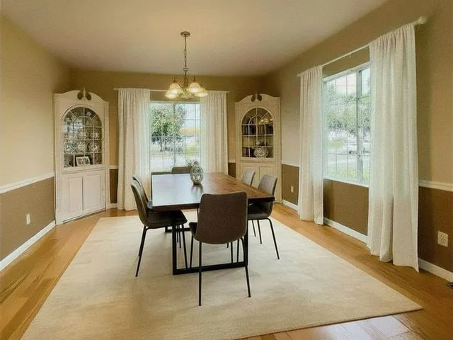 a view of a hallway to rooms