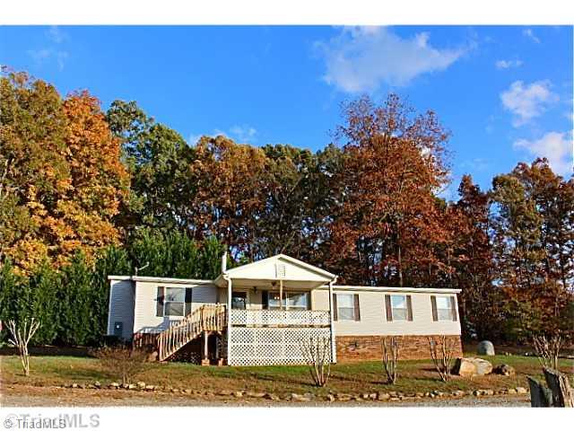 3846 Earnhardt Road Asheboro, NC 27205 - Photo 1 of 10 Exterior Front. The home is situated perfectly with expansive views of the property. It has a nice covered porch in front and on the rear of the home.