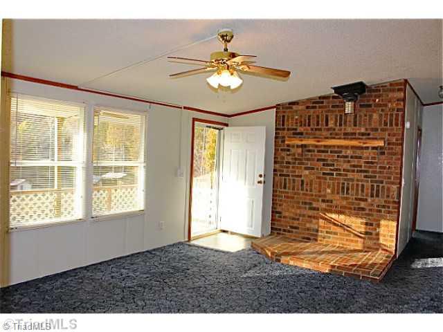 3846 Earnhardt Road Asheboro, NC 27205 - Photo 4 of 10 Living Room. The living room is ready for your wood stove and looks out the front to the wonderful views.
