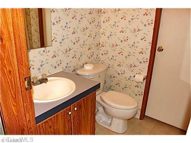 3846 Earnhardt Road Asheboro, NC 27205 - Photo 8 of 10 Bath. The second bathroom is in the hallway and can be accessed from the hallway or through the laundry room.