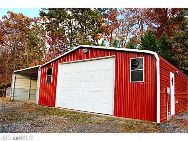 3846 Earnhardt Road Asheboro, NC 27205 - Photo 9 of 10 Outbuilding. This workshop has a concrete floor and is wired It has an attached carport with concrete parking pad.
