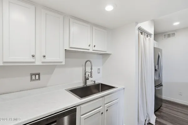 a kitchen with a stove and a microwave