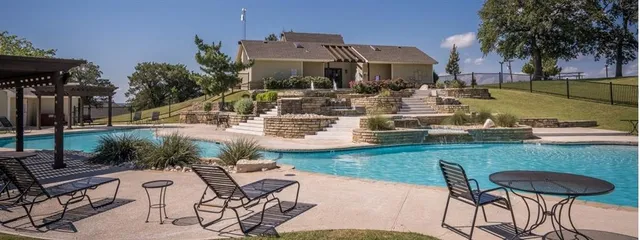 a view of a chairs and table in patio