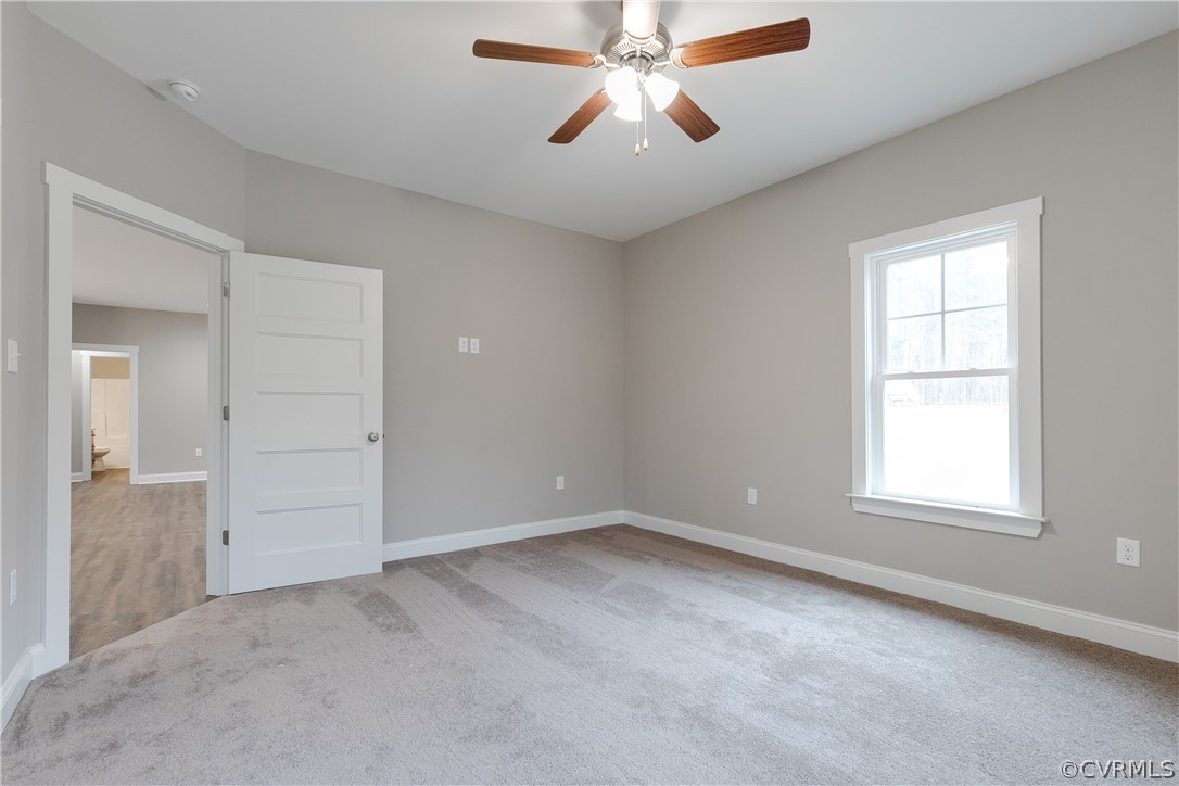 2922 Lowry Road Columbia, VA 23038 - Photo 23 of 25 an empty room with windows and fan