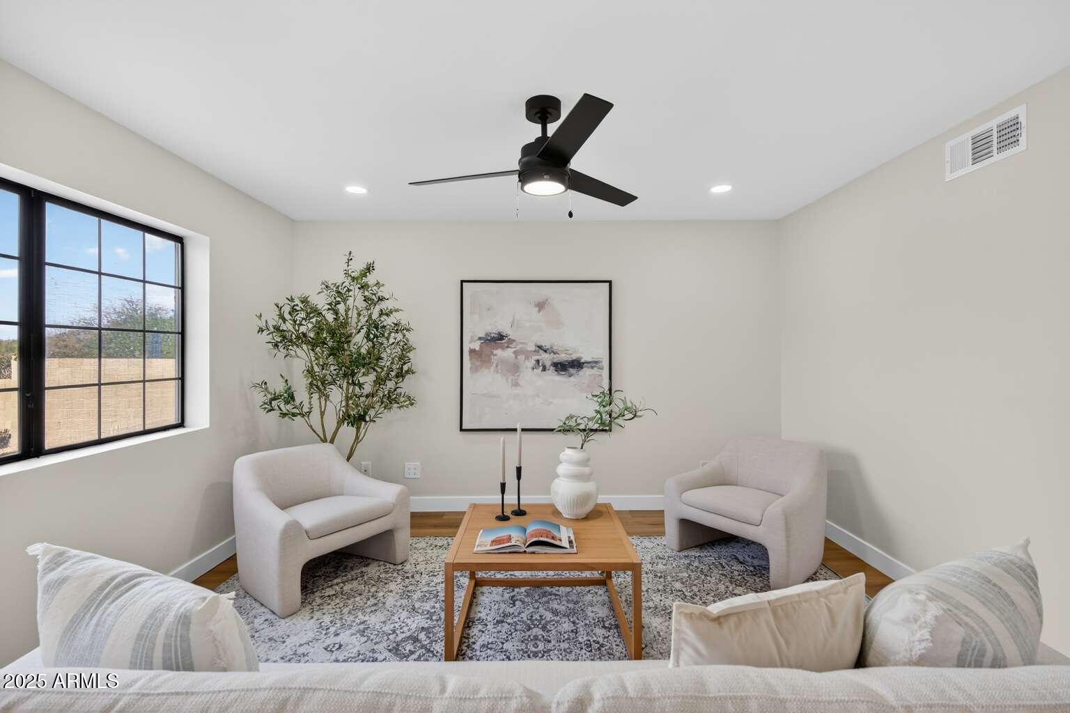 15850 North 15th Way Phoenix, AZ 85022 - Photo 13 of 43 a living room with furniture and a large window