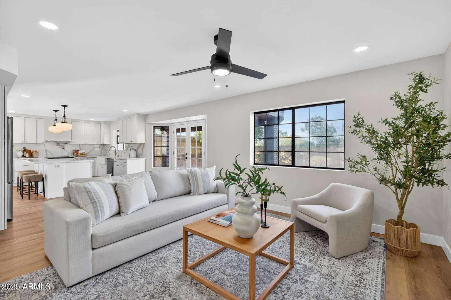 15850 North 15th Way Phoenix, AZ 85022 - Photo 14 of 43 a living room with furniture and a potted plant