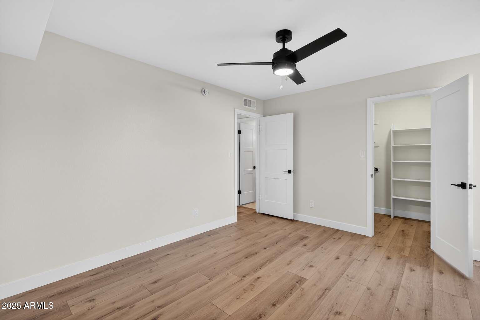 15850 North 15th Way Phoenix, AZ 85022 - Photo 15 of 43 wooden floor in an empty room