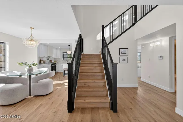 a living room with furniture and a stairs