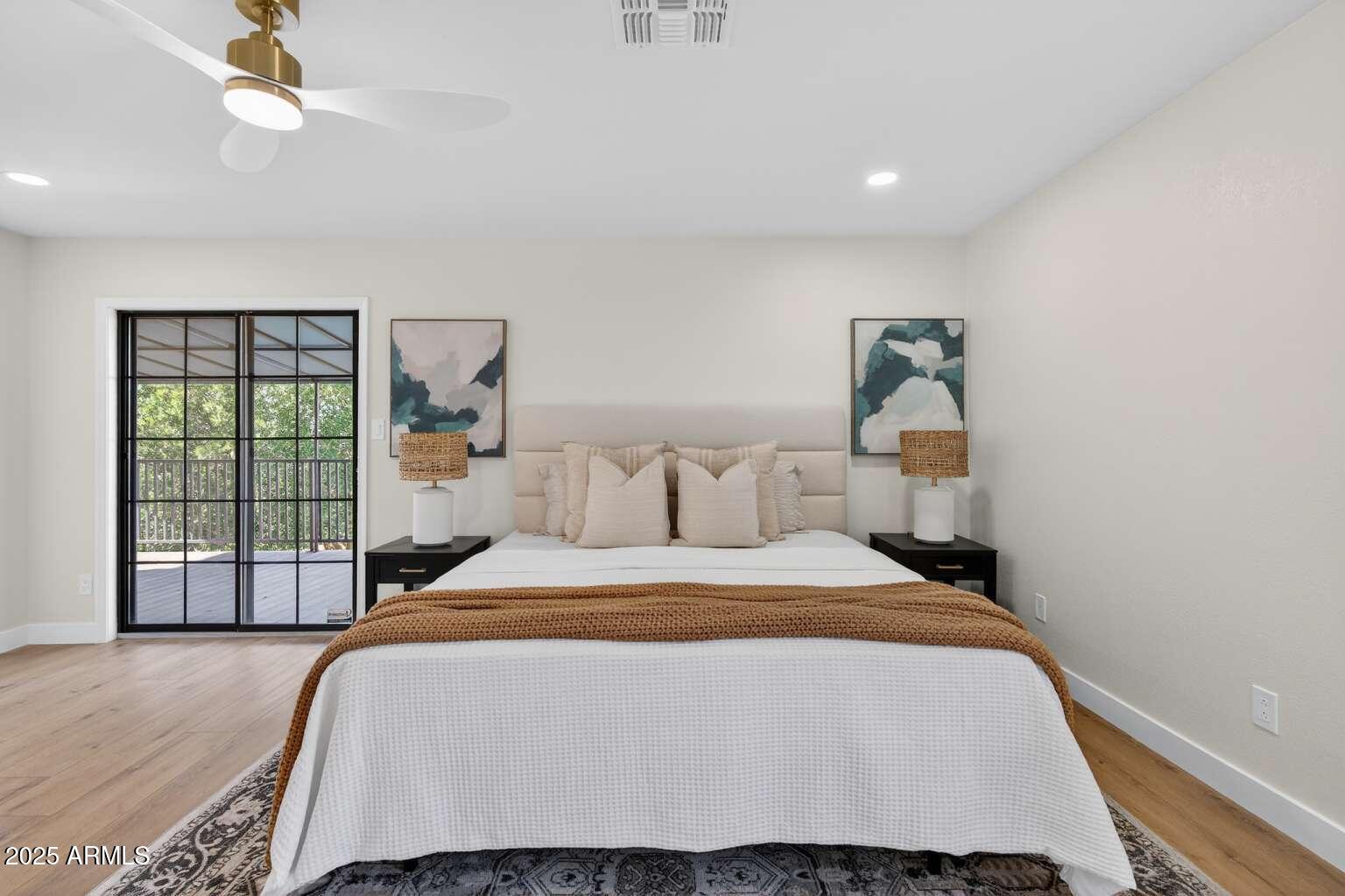 15850 North 15th Way Phoenix, AZ 85022 - Photo 20 of 43 a bedroom with a bed and a large window