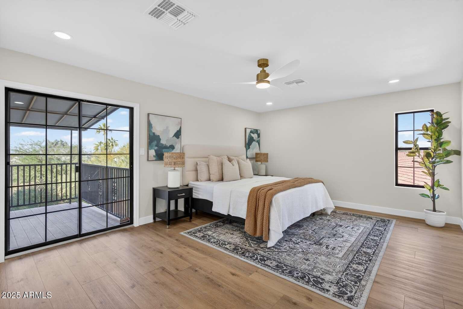15850 North 15th Way Phoenix, AZ 85022 - Photo 22 of 43 a spacious bedroom with a bed and a window