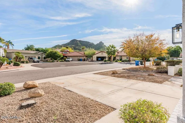 a view of a city street with tall buildings